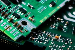Electronic circuit board. Semiconductor motherboard circuit board technology. Mainboard of computer. Integrated semiconductor microchip on green circuit board. Hi-tech industry and computer science.