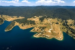 Aerial view of the amazing lake coast with calm water, Dospat, Bulgaria