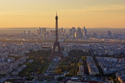 Eiffel Tower, Les Invalides and business district of Defense at orange sunset, as seen from Montparnasse Tower, Paris, France
