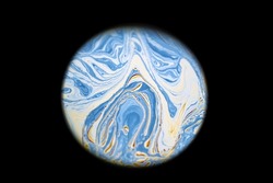 Multicolor psychedelic abstract round blue planet in universe. Closeup soap bubble like an alien planet on dark background
