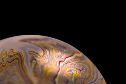 Multicolor abstract cold alien planet with an atmosphere in universe. Closeup soap bubble