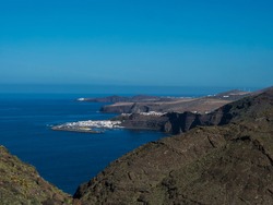 Seascape view of Puerto de las Nieves, traditional fishing village port with cliffs and rocky atlantic coast in the north west of Gran Canaria, Canary Islands, Spain.