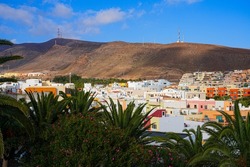 Holiday homes in Morro Jable, a resort town on the island of Fuerteventura - Residential area built at the bottom of a volcanic mountain in the Canary Islands, Spain