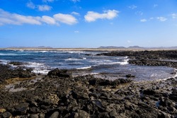 Caleta del Marrajo, a windy bay on the north coast of Fuerteventura in the Canary Islands, Spain - Desertic landscape near the Atlantic Ocean