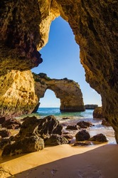 Albandeira Beach.Arch Albandeira. Portuguese Algarve Coast, cliffs, beaches and spectacular and beautiful landscapes