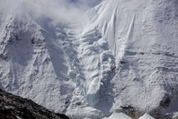 Snow Mountain, Large Glacier, Wall of Ice, Mountain Cliff Face covered in ice, glacial ice, pure white snow covered landscape, high altitude mountain