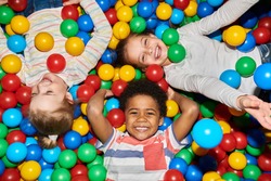 happy little kids in ball pit