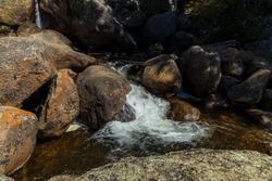Beautiful stream rushing down a steep incline along Guanella pass road in Colorado