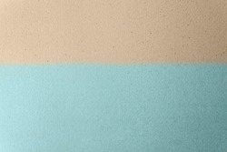 Sandy Light brown split with soft light blue on craft cardboard box paper background. Beach scene concept