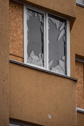 Broken glass. Broken windows of the apartment. The terror of civilians. Russia's war crime. War in Ukraine. Consequences of enemy shelling. 