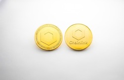 Two Chainlink golden coins photographed on a white background, as a product shooting 