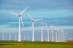 Windmills for electric power production Netherlands Flevoland, Wind turbines farm in sea, windmill farm producing green energy. Netherlands