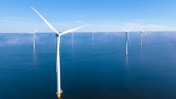 Wind energy in the Netherlands, Sustainable, renewable energy. Wind turbines generate electricity. Windmill farm in the ocean, Green technology. Renewable resource. Sustainable development.
