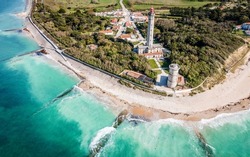 Aerial drone panorama shot of the Phare des Baleines or Lighthouse of the Whales taken from the sea on Ile de Ré or island of Re in France