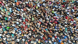 Aerial. People crowd background. Mass gathering of many people in one place. Top view.
