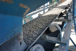 Aggregate transportation by conveyor belt at concrete mixing plant