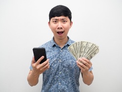 Man feel excited holding mobilephone with a lot of money