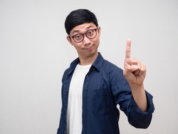 Young man wear glasses show finger up number one portrait