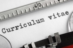 Curriculum vitae written on an old typewriter concept for job search
