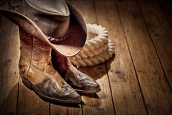 Country music festival live concert or rodeo with cowboy hat and boots background