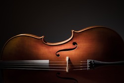 Silhouette of a Cello on black background with copy space for music concept