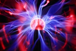 Plasma ball lamp energy, touching glowing glass sphere concept for power, electricity, science and physics