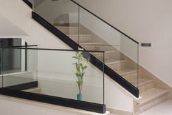 white interior with glass fence and stairs