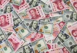 US dollar bill and Chinese yuan banknote. USD vs RMB.