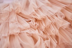 Soft pink fabric in pastel colors. Fabrics for luxury elegant dresses for children or adults.