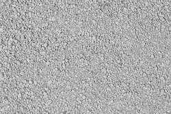 Small rocks ground texture background. white road stone. gravel pebbles stone texture. crushed granite. close up. grey clumping clay. cat litter