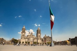 Metropolitan Cathedral at Zocalo main square and Mexican flag Mexico City 