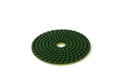 Green diamond flexible abrasive disc for grinding machine isolated on white background.