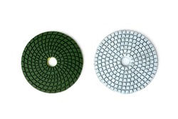 White and green diamond flexible abrasive discs for grinding machine on white background.