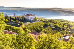 View Of Aiguines Village And Renaissance-style Chateau Overlooking Lac de Sainte Croix Lake-Alpes de Haute Provence,France