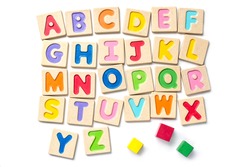 Wooden alphabet blocks with letters on white background