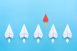 Small business concept with small red paper plane on blue background