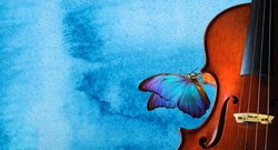 violin on blue watercolor background closeup. beautiful blue butterfly morpho on violin. music concept. copy spaces. blues music concept