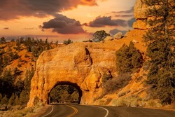 Red Rock Canyon, near Bryce NP.  Utah Highway 12 passes through a natural bridge in the orange red limestone rocks.