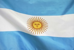 Fabric texture flag of Argentina. Flag of Argentina waving in the wind. Argentina flag is depicted on a sports cloth fabric with many folds. Sport team banner.