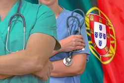 Close-up medical team man and woman surgeons of the Portugal flag background. Professional surgery in Portugal. Medical technology research institute and doctor staff service concept in Portugal