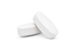 Close-up white two calcium or Vitamin and mineral pills tablets isolated on white background with clipping path.
