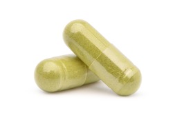 Close-up Two Herb powder capsules isolated on white background. Clipping path.