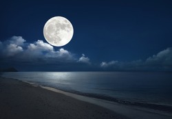 Full moon over the sea with tropical beach. (Elements of the moon image furnished by NASA)