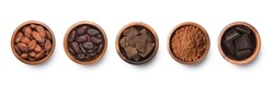 Chocolate ingredients in wooden bowls, cocoa beans, chocolate mass, cocoa powder, chocolate bars. Flat lay isolated on white background.