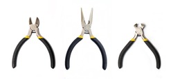 Kit pliers tools with black rubber handles for the master electrician on white background