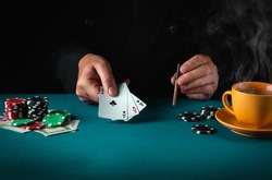 Playing cards with a winning combination in poker of three of a kind or set in the hand of a professional player. Success or fortune in the casino.