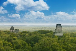 Tikal, Guatemala. View from Temple IV on limestone temples in the jungle.