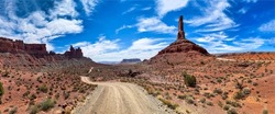 Panorama of the road through the canyon desert. Canyon desert road panorama. Canyon road panoramic landscape. Canyon desert panorama