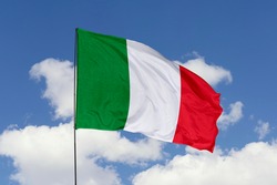 Italy flag isolated on the blue sky with clipping path. close up waving flag of Italy. flag symbols of Italy.