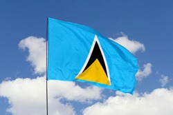 Saint Lucia flag isolated on sky background with clipping path. close up waving flag of Saint Lucia. flag symbols of Saint Lucia.